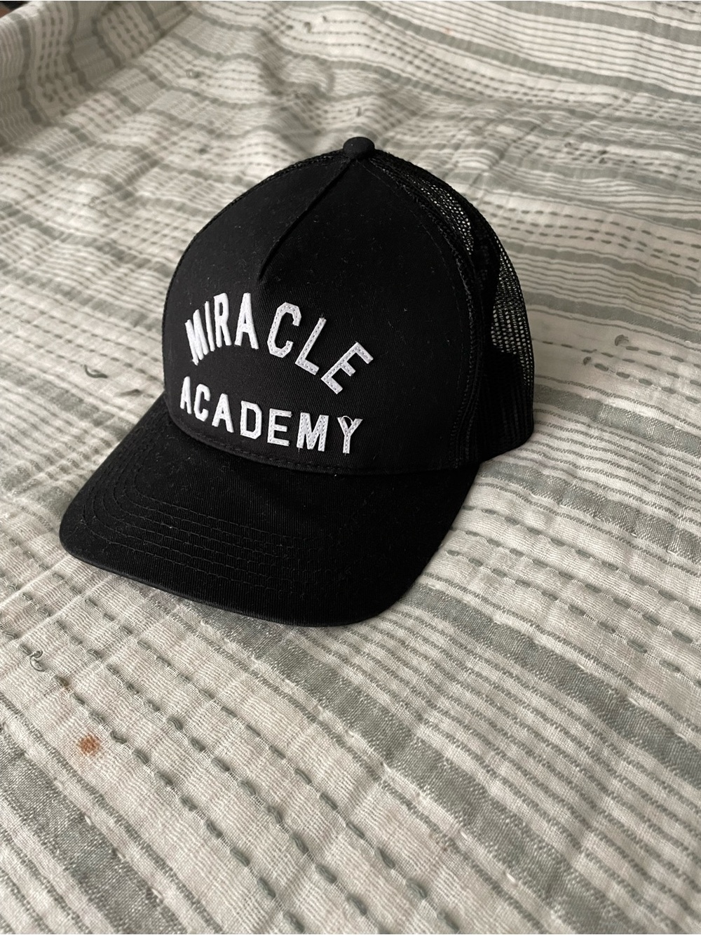 Miracle Academy Black Embroidered Trucker Hat